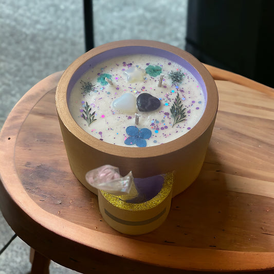 Ceramic candle on small wooden table