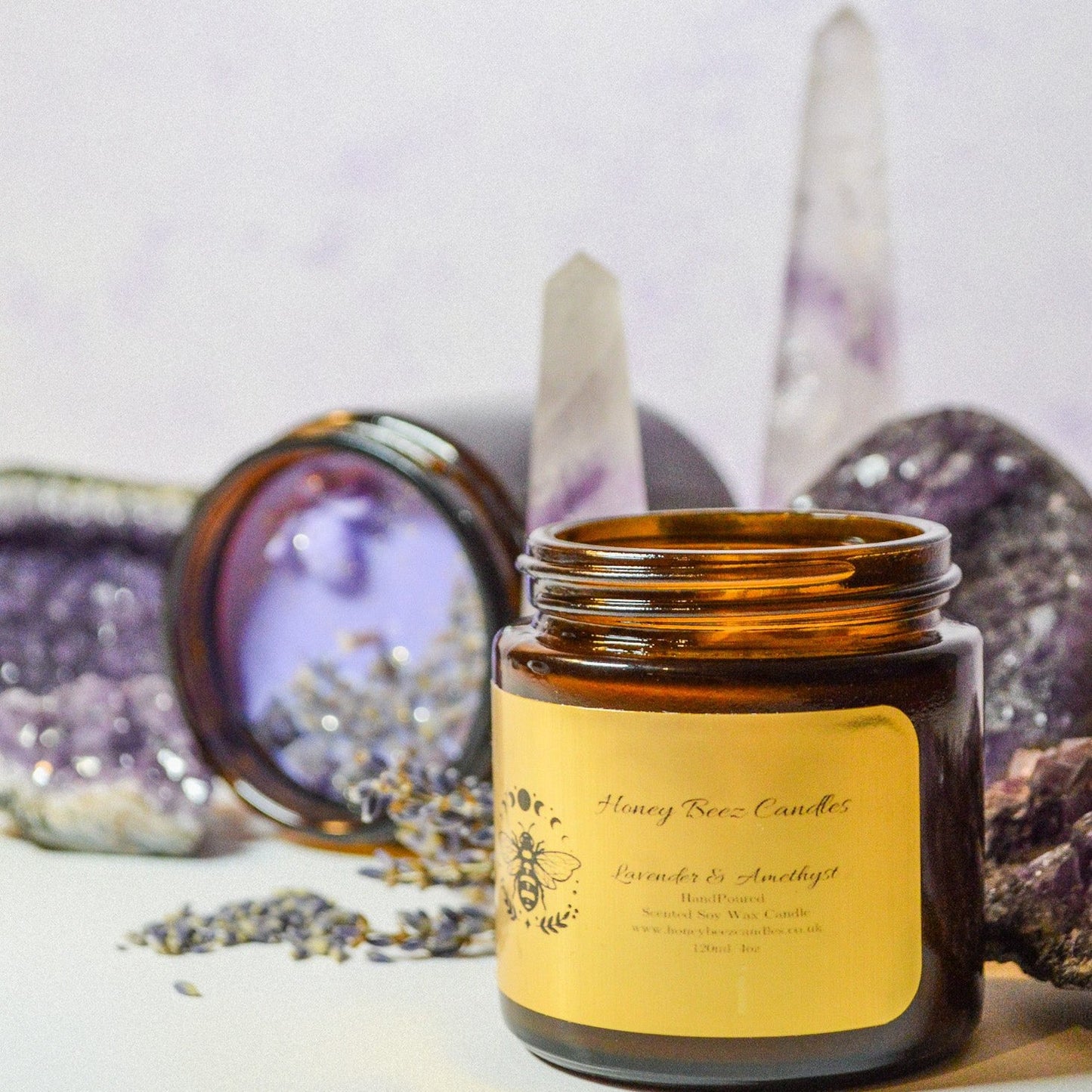 Brown glass jar with lavender candle inside